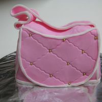 Purse Cake Marshmallow fondant covered, gold dragees.