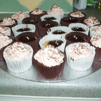 Chocolate Cupcakes Chocolate and vanilla cupcakes wither buttercream swirls and chocolate ganache