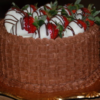 Basketfull Of Berries Chocolate buttercream icing in basket weave pattern topped with chocolate dipped strawberries.