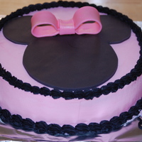 Minnie Cake is iced with tinted buttercream. Minnie cut out and bow is fondant. My daughter wanted a Minnie Mouse cake for her 4th birthday. She &...