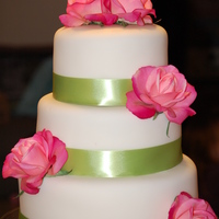 Alice White fondant with satin ribbon and artificial roses. I saw them while getting flowers to make my mother in law's wedding bouquet, etc...