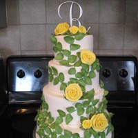 Leaves And Roses My second wedding cake. The leaves are all handmade and dusted, there are about 200 of them. The roses were also handmade. Very fun cake to...