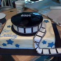 Film Reel This cake was made for my cousin who is studying film in college. Cake is decorated with fondant, gumpaste and royal icing.