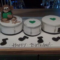 Marching Band Drums This cake was made using fondant and the monkey was made with rice krispy treats and also covered in fondant. Thanks for looking!