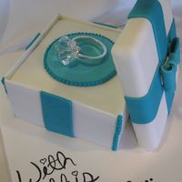 With This Ring This was an engagement cake that was done for good friends of mine, we were lucky enough to find a paper weight that matched her ring...