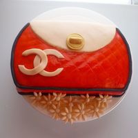 Chanel Clutch Purse I used a 10 inch round cake pan to make this cake. The original design was supposed to be an orange Coach purse but I was messing up on the...