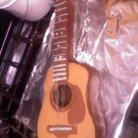 Acoustic Guitar Fondant covered German chocolate WASC cake with pecan coconut filling and a chocolate buttercream. Some accents were made using 60% cocoa...