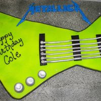 Metallica Guitar Birthday Cake This cake was made for a 9 yr. old's birthday. He was very involved with this cake. He knew what color he wanted the guitar as well as...