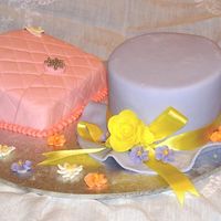 Hat & Purse Cake Fondant covered cakes with gumpaste and royal icing piped flowers.