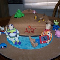 Toy Story Toy Box This is a toy box surrounded by the characters from the Toy Story movie. I made all of the characters out of fondant. The toy box is a 9 x...