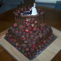 Grooms Cake Chocolate cake with chocolate fudge icing and chocolate covered strawberries.