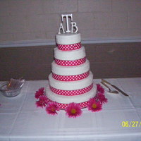 Cornelia Lace And Pink Ribbon Cornelian Lace with pink polka dotted ribbon on each tier.