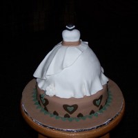 Bridal Gown Cake This is my first attempt at a Bridal Gown. The bride wanted it decorated in the colors of her new home. (Chocolate brown, bronze and aqua)...