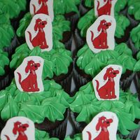 Clifford Cupcake Parade Triple Chocolate Cupcakes covered with cream chease buttercream!!! and a handmade clifford Toothpick decoration!! thanks for looking!!!