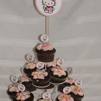 Hello Kitty Cupcake Tree Chocolate Cupcakes with cream chease buttercream icing colored, with a hello kitty toothpick decoration, Thanks for looking! :)