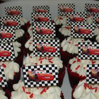 Cars Cupcake Parade triple chocolate cupcakes covered with cream chease buttercream and topped with a handmade toothpick of lightning McQueen.Thanks for...