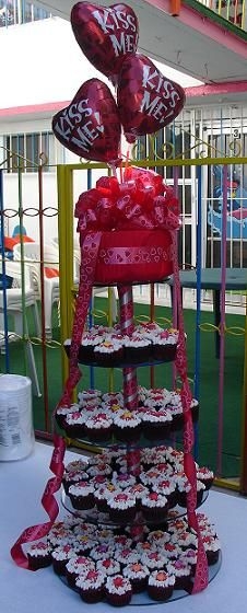 Valentine's Day Cupcake Tower Chocolate Cupcake Covered with Cream Cheese Buttercream and heart candy decoration, I made 100 for my kids shool celebration today, Thanks...