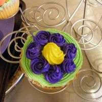 Pretty Blue Flower Blue flower ontop of cupcake. First time useing piping bag. WOO HOO for me!!!