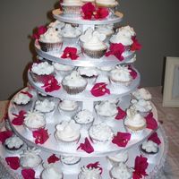 Wedding Cupcakes On Tree This is a Cupcake tree Wedding. The Cupcakes were chocolate and white with buttercream icing. The hearts and flowers were made with rolled...