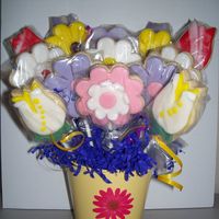 Spring Flower Cookie Bouquet This is a spring cookie bouquet, for a April birthday. The cookies are NFSC with rooled buttercream icing.