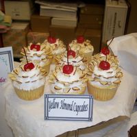Yellow Almond Cupcakes These cupcakes were for a wine tasting event. They are yellow cake with alomond buttercream icing topped with a cherry. There were also...