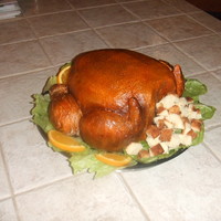 My Turkey!!! This is my first sculpted cake......was a blast doing it...its a light pound cake with peaches and buttercream filling....Icing was...