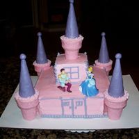 Castle Cake This is my first castle cake. It was the most fun cake I've done yet. It was for a six year old girl birthday. The cake was yellow...