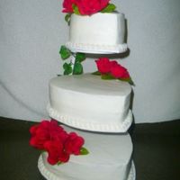 Wedding Cake I used the Floating Tier Stand. Bride wanted a simple wedding cake with red artificial roses. All BC, border is tip 199 shells, w/ tip 14...