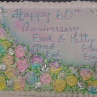 60Th Anniversary, Diamond Anniversary half sheet, buttercream, all roses are white, and were airbrushed the colors, and has plastic diamond and doves in the roses