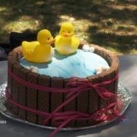 Ducks In A Barrel Thanks to the idea here. So this is my 5th cake. 2 chocolate cakes filled with chocolate filling. Blue marble fondant on top. Nutty bars...
