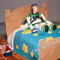 Toy Story I made this cake for my grandson's 3rd birthday. It was inspired by many cakes I saw here, Thanks! The bed is the cake, all of the...