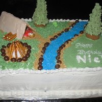 Camping Bday for friend's son that loves to camp. Carrot cake/BC icing. First gumpaste person (thank goodness only 1 dimension). I put a...