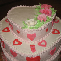 Valentine's Birthday Top tier chocolate cake w/chocolate mouse filling. Bottom is yellow cake w/strawberry filling. Covered in BC with fondant hearts and my 1st...