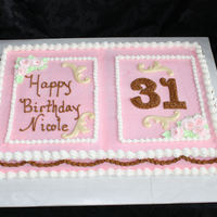 Nicoles Birthday Happy 31 Base of cake frosted all in buttercreme, this young lady loves pink and brown together, I melted white chocolate and molded into swrils...