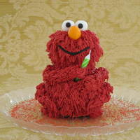 Elmo I used the Wilton mini-bear mold and carved the face some. This was the mini cake for the birthday girl. I also made a simple two tiered...