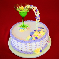 Bridal Shower Cocktail Party Theme Buttercream with RI flowers. The cocktail glass is plastic and the flowers "flowing" from it are attached to wire via more RI....