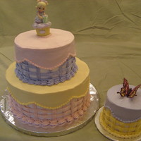 Precious Moments Precious Moments cake for a first birthday. Both cakes are chocolate with coockies-n-cream filling, covered in buttercream frosting. The...