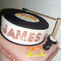 James 21St Birthday 8 inch round Cherry Ripe Mud CakeRectangle Vanilla CakeCovered in fondant with fondant decoations. Dowel used for record needle