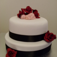 Loreena's Baby Shower Cake 6 inch round cherry ripe mud cake8 inch round red velvet cakecovered in fondantblack satin ribboni cheated and bought the deep red rosesi...