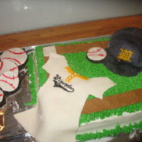 Celebrating 20 Years chocolate cakebuttercream frosting and fondant decorations. The baseball hat(my first attempt) was made out rice krispies