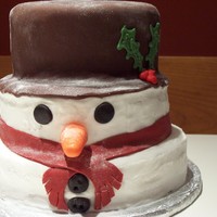 First Snow Man Cake My first attempt at a snow man cake. He looks a bit squished but cute non the less. Next time I'll do each layer 3 high not 2.