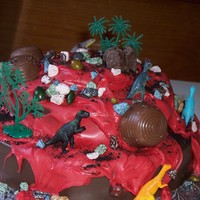 Smash Cake Volcano Not my best Smash Cake but it will do. All hard chocolate stuffed with treats and toys. The 9 year old boy it's for, won't mind...