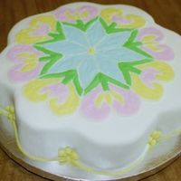 Tulips Fondant covered petal cake. Tulips piped on with buttercream.