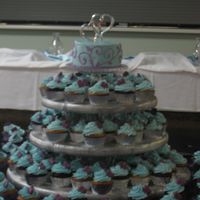 Cupcake Wedding For a friend's wedding - buttercream with candy mold hearts. The couple opted for a topper cake to cut for the reception.