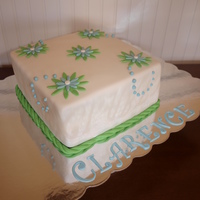 Clarence's Cake I made this for a charity that I belong to. It is a white cake with buttercream frosting covered in white fondant decorated with green and...