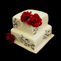 Victorian Swirl And Roses The swirls were just painted on (nerve racking to say the least) and the roses are made out of gumpaste. Wasn't sure how the cake was...