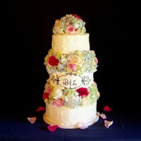 Bunches Of Hydrangeas Buttercream iced cake with real hydrangeas and roses.