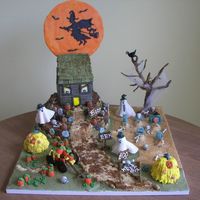 Haunted House On The Hill This was a halloween birthday cake. The two bases (10 inch & 12 in rounds) are covered in double chocolate buttercream. All is edible...