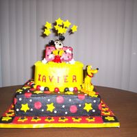 Mickey Mouse This was for a 1st birthday for the grandson of a friend. Cake is white chocolate and marbled with dutch chocolate. All three filled with...