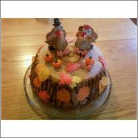 Happy Turkey Day! A friend and I did this cake for her to take to her family Thanksgiving. While placing the top layer, it cracked in 4 places so we did a...